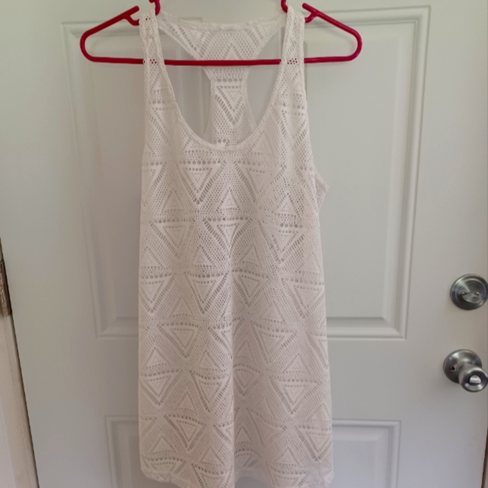 White bathing suit cover up.